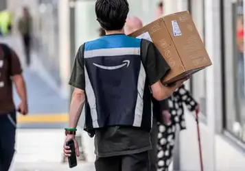 Amazon raises starting pay to $20 an hour and adds Whole Foods discount