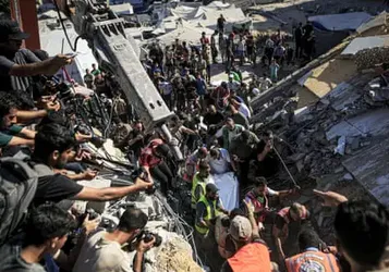 At least 12 killed after building in Gaza City damaged by Israeli strikes collapses
